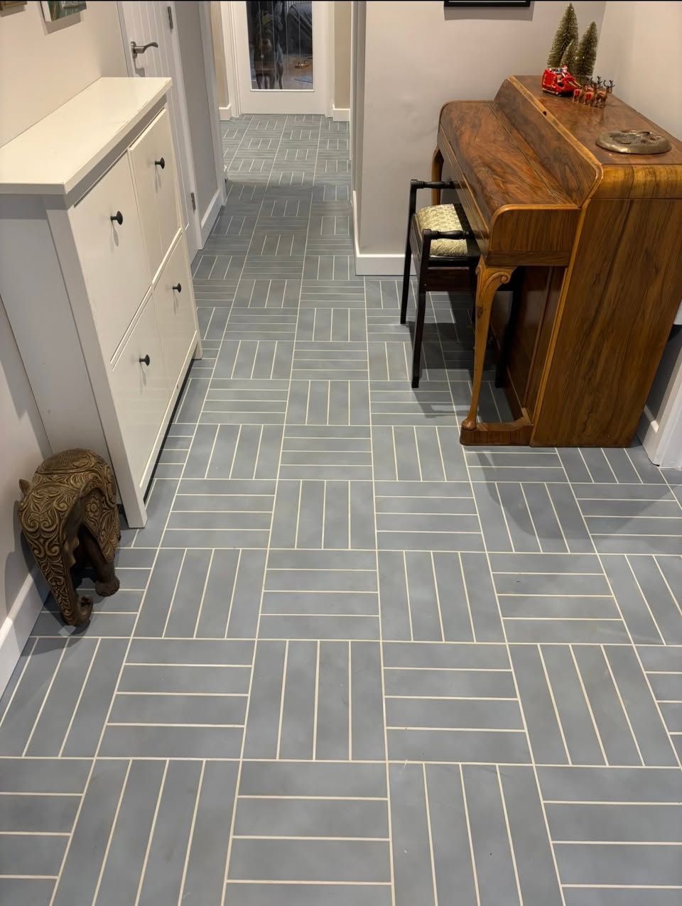 Finished grey herringbone tiled hallway floor by Luke Robinson Tiling in Norwich