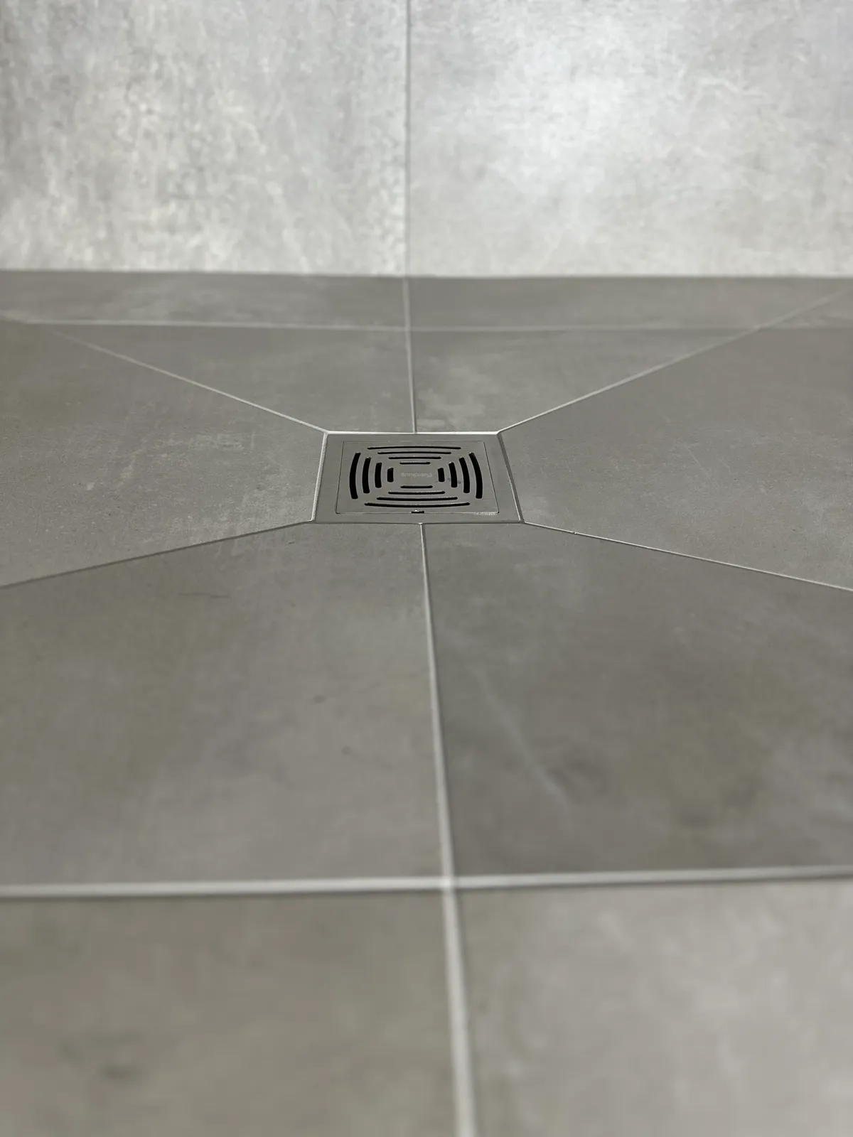 Bright grey tiled shower room in Norwich