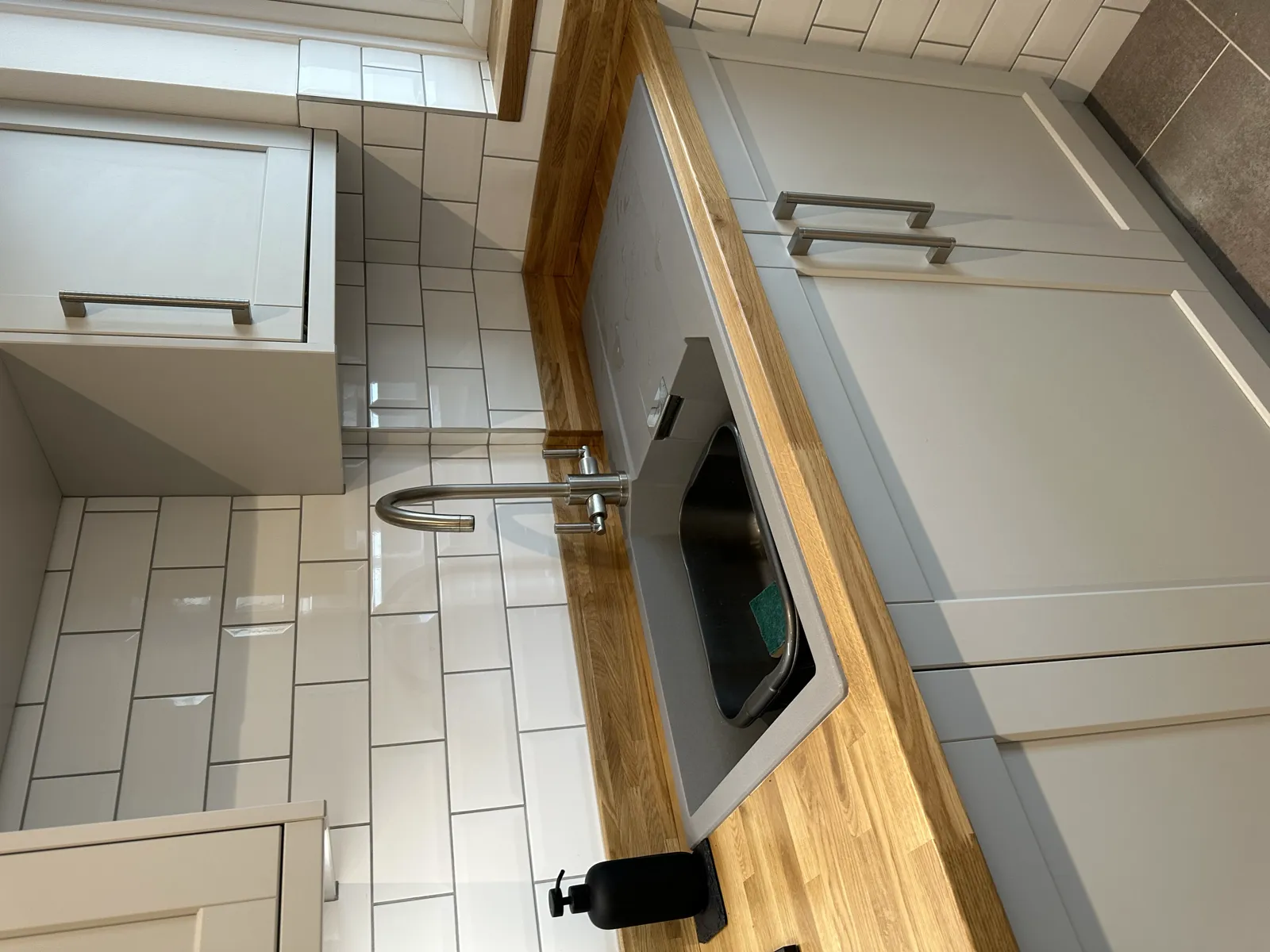 Grey tiled wet room with linear drain