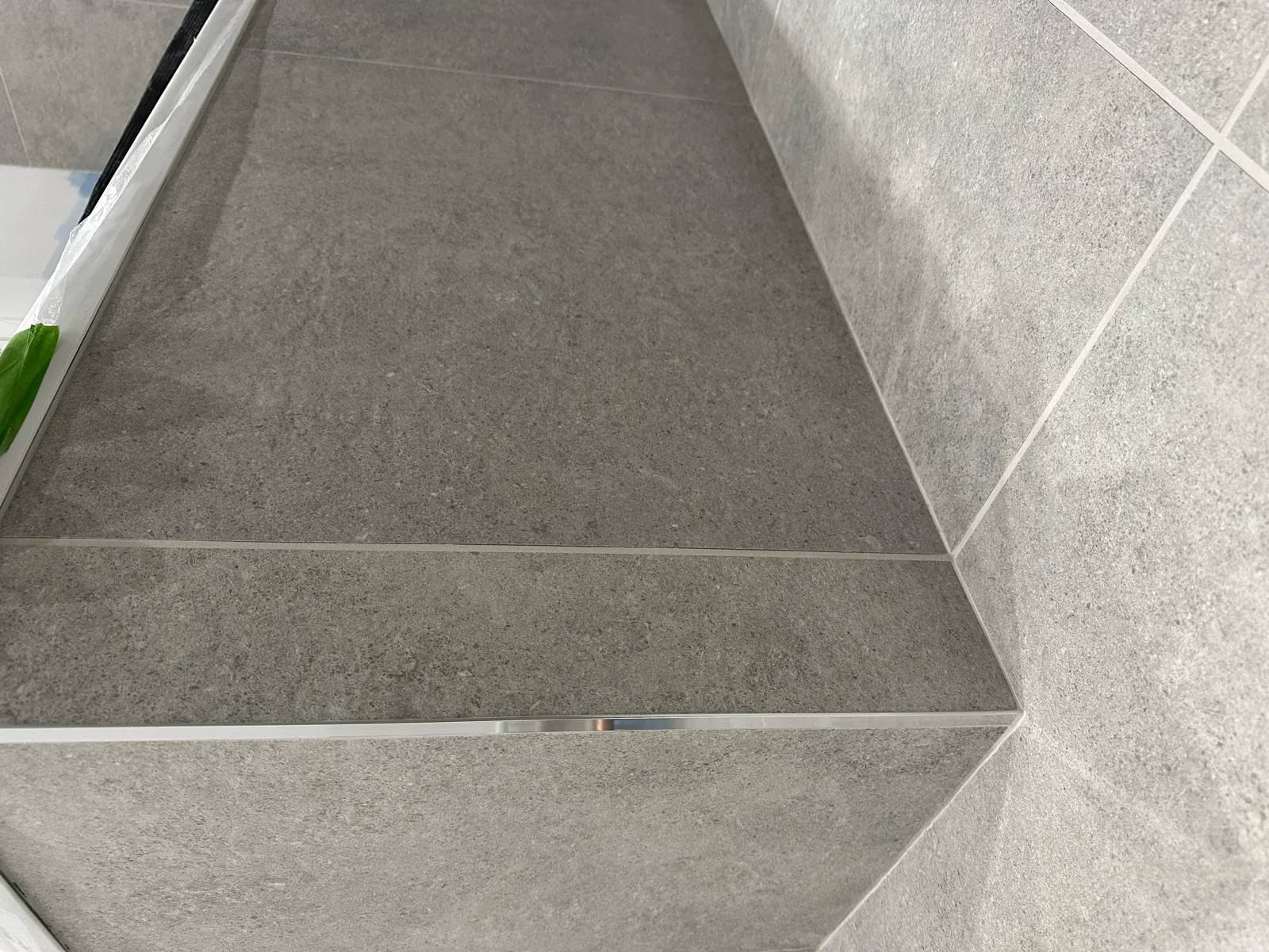 Grey marble-effect tiled shower