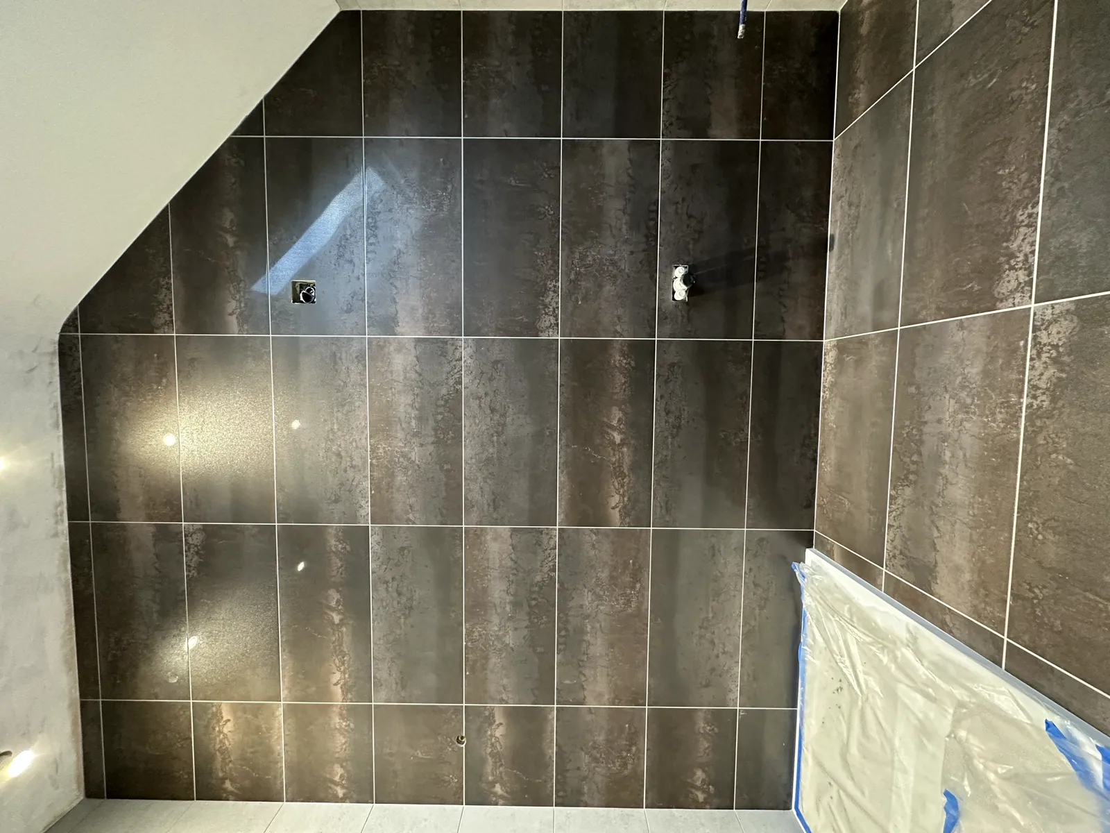 Charcoal large-format bathroom wall tiling