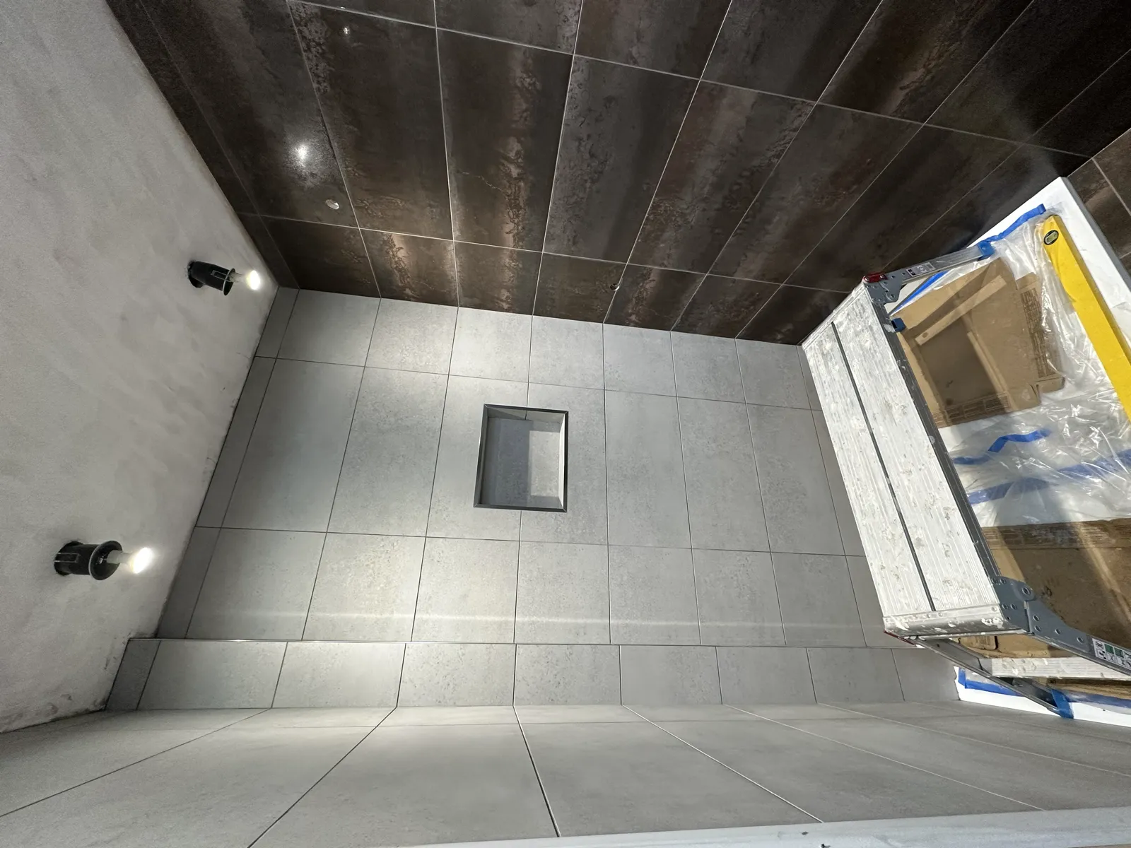 Grey large-format tiled walk-in shower room in Norwich
